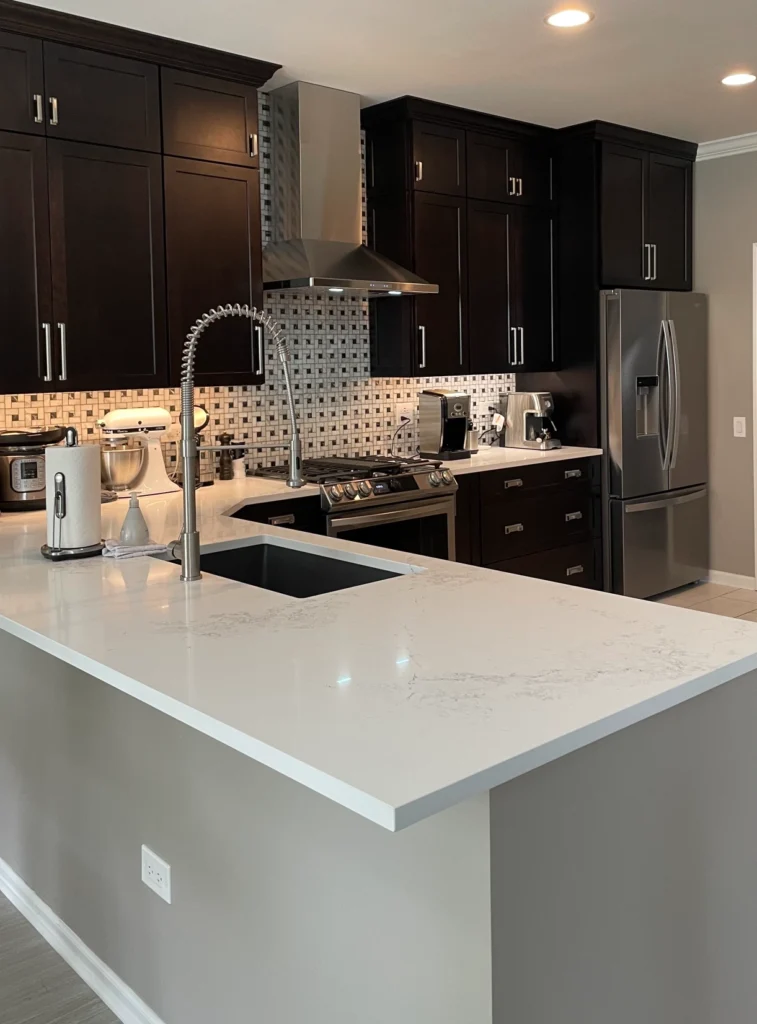 Fully installed countertop with undermount sink in modern kitchen.