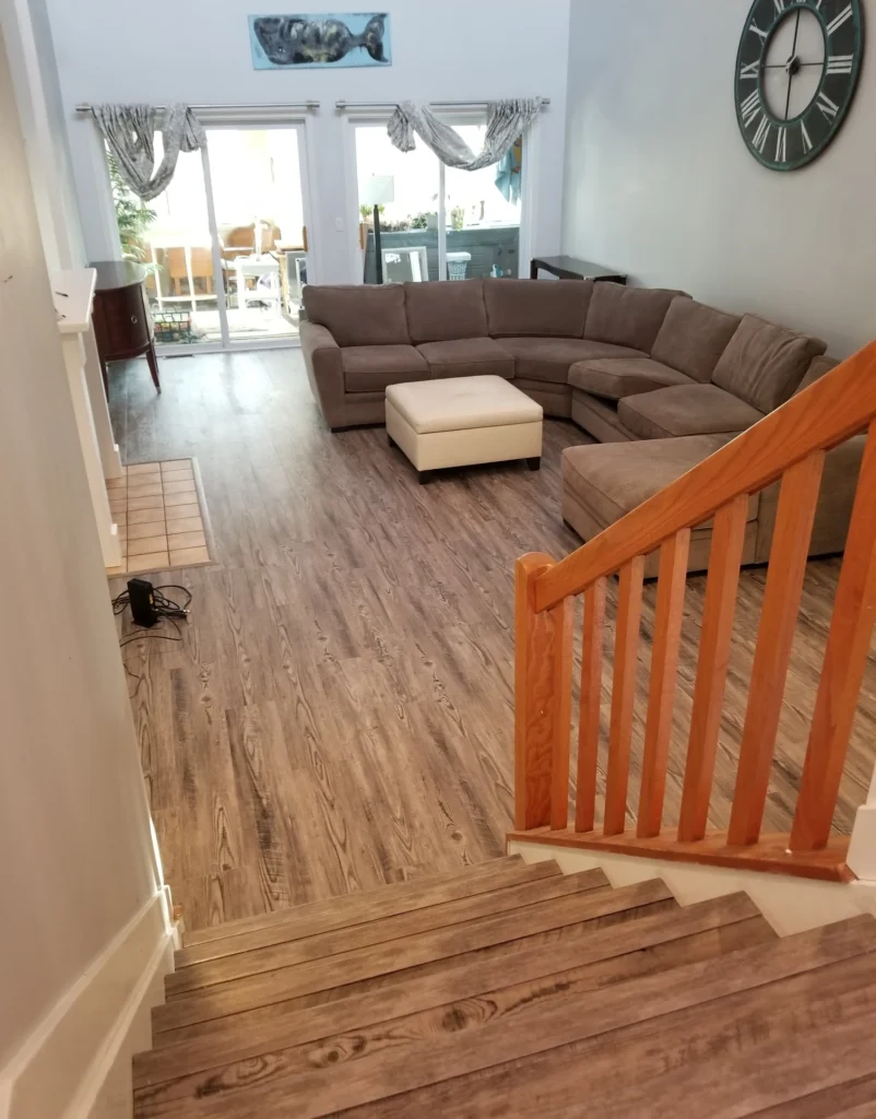 Professional hardwood floor installation in living room.