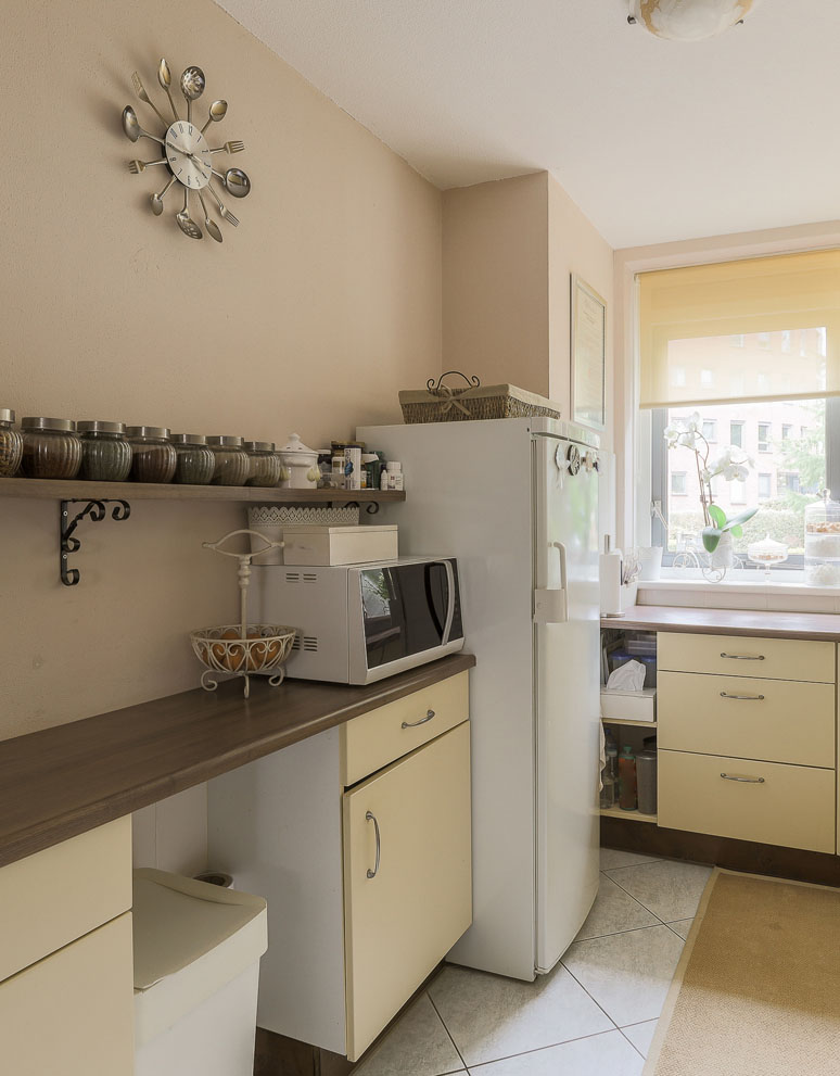 Installed custom kitchen cabinets with integrated oven space.
