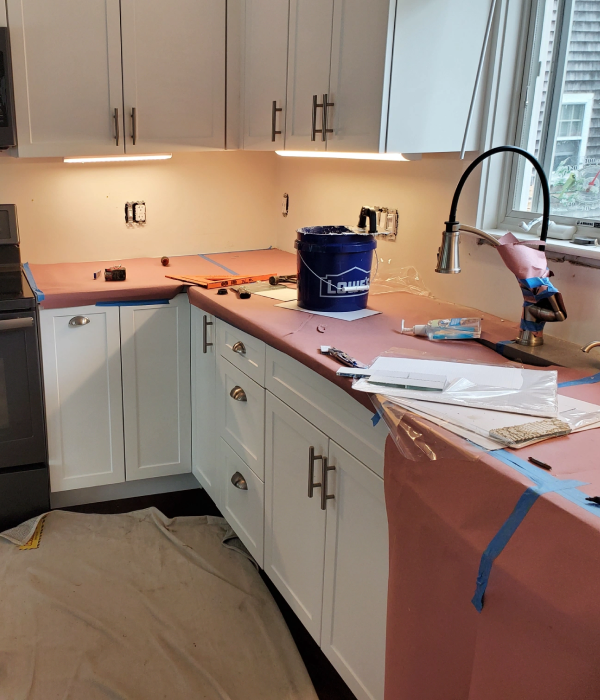 During the kitchen countertop installation.