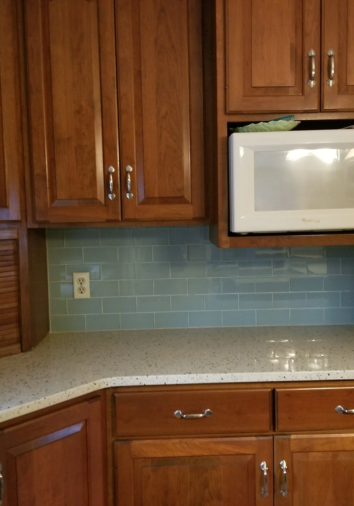 Cabinet installed with a tiled backsplash.