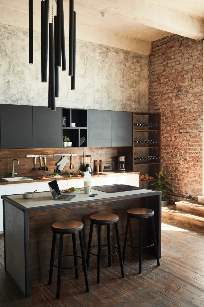 Newly remodeled kitchen with black cabinets and countertops.