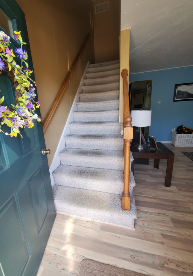 Stairs and handrails installed in the living room.