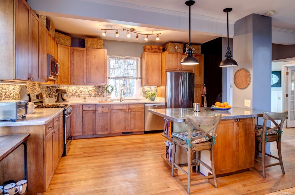 A modern, family-friendly kitchen remodel showcasing features like ample storage, an open layout, and child-safe design elements. The image highlights the benefits of a kitchen remodel for growing families.