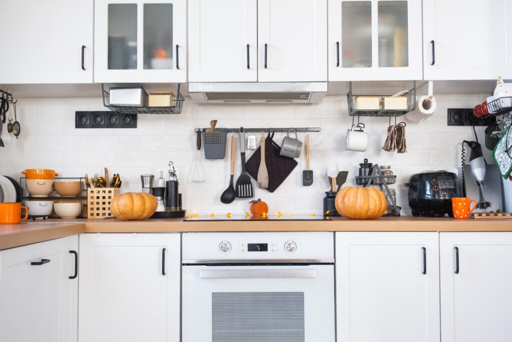 A clean and organized kitchen with white cabinets, ready for kitchen cabinet installation or showcasing the finished result.