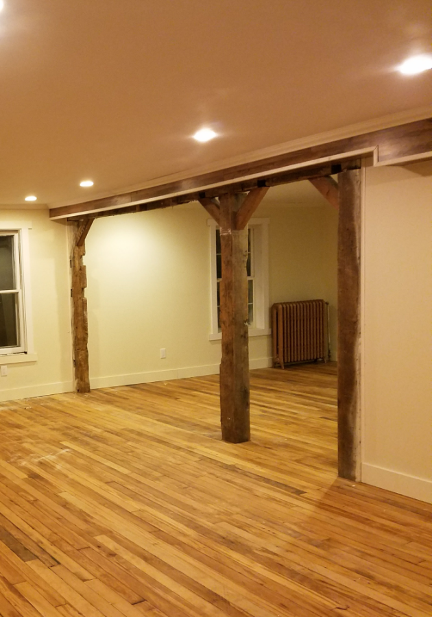 Newly installed hardwood flooring in a modern living room.