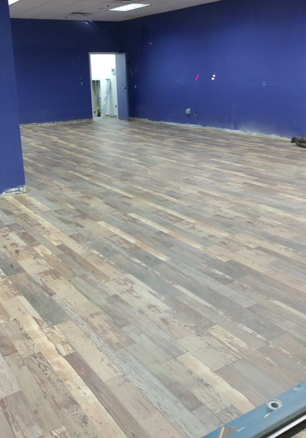 Evened-out subfloor surface after leveling in living room area.