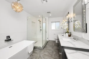 A luxurious bathroom featuring a large soaking tub, frameless shower enclosure, and marble countertops. This image highlights the types of upgrades possible with professional bathroom repair.