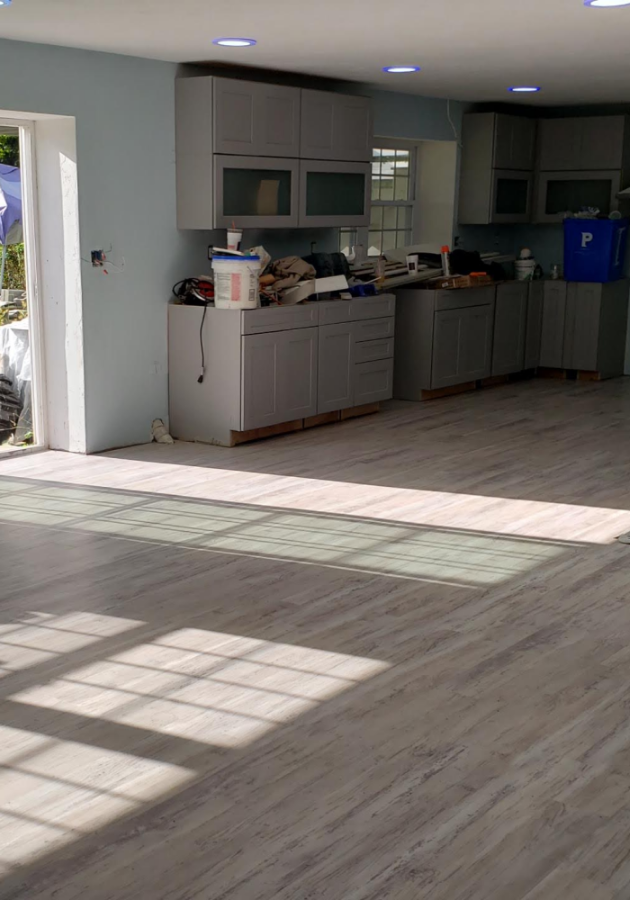 Luxury vinyl plank flooring with natural wood finish in living room.
